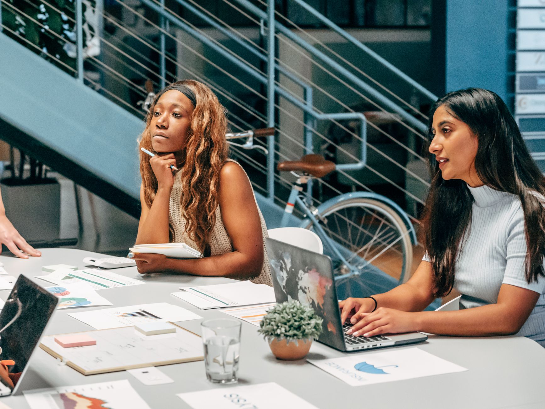 Colleagues sharing a focused work session around a table