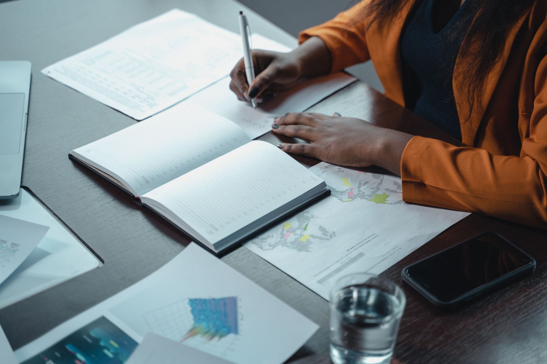 Professional reviewing charts and writing transition notes