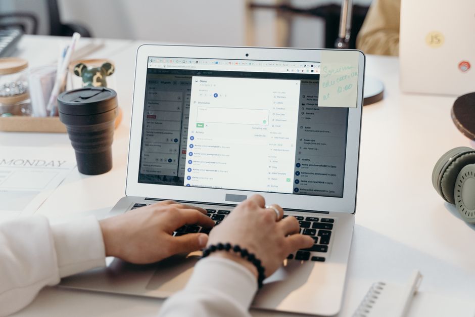 A concise email is prepared at a bright office desk.