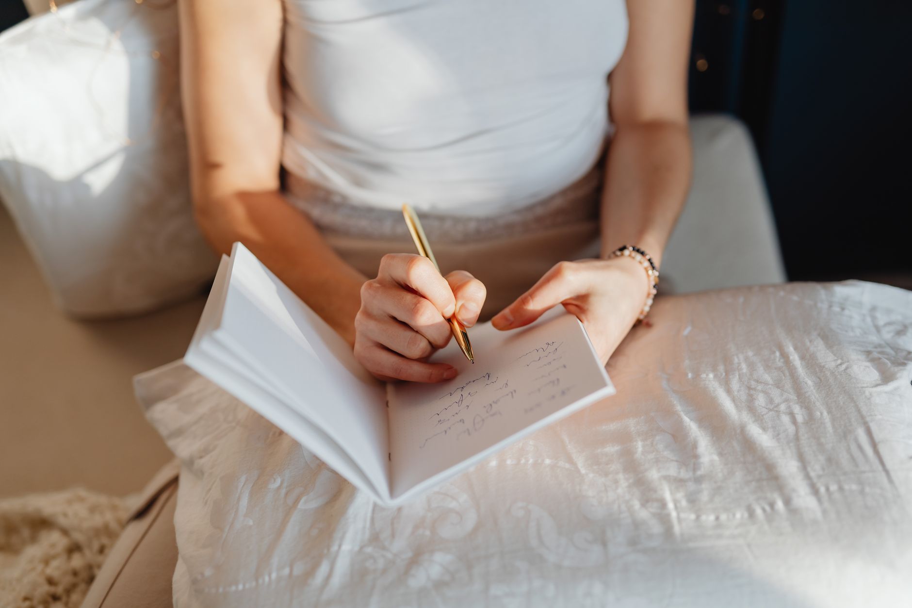 Person writing reflections in a journal