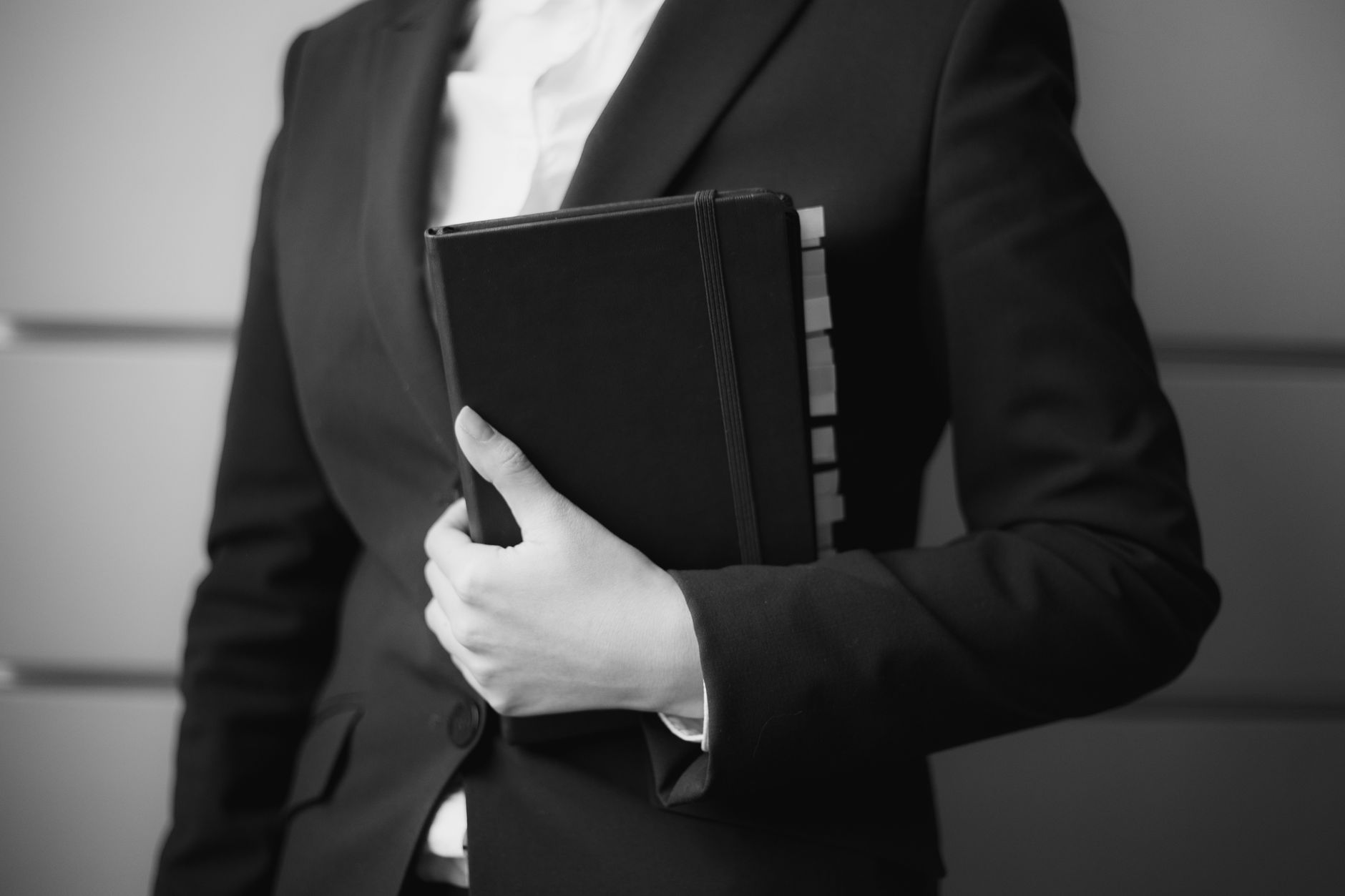 Professional holding a compact paper planner